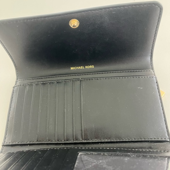 Michael Kors Black and Brown Logo Wallet
Trifold. - Picture 5 of 6